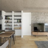 【完成予想図】テレビ背面には、空間全体の印象を引き締めるアクセントウォールとしてエコカラットを採用しました。機能性・デザイン性に優れています。