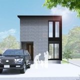 柔らかな質感の大判タイルが、落ち着きのあるモダンな存在感を与える外観デザインです。