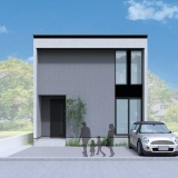 シンプルなグレーの外観に、軒と袖壁がつくる陰影が建物に奥行きをもたらし、街並みに自然と溶け込みながらも印象に残るデザインの住まい。